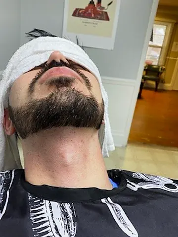 Hot towel treatment at Tactical Grooming